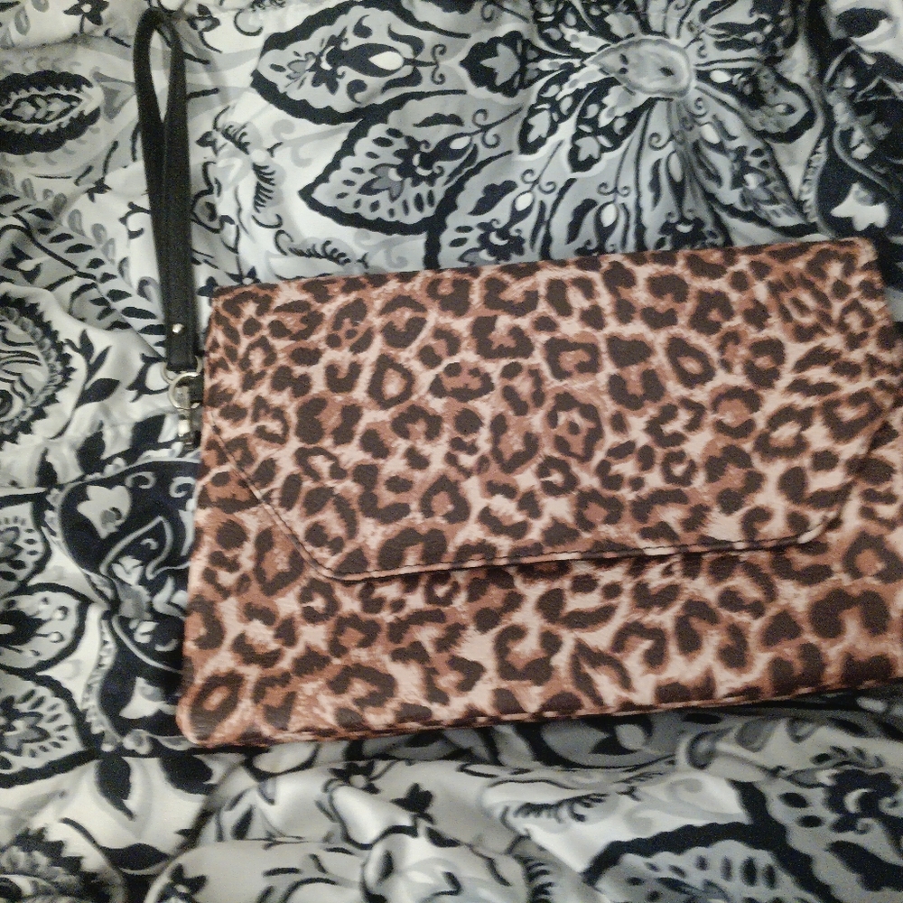 Used. Cheetah print clutch